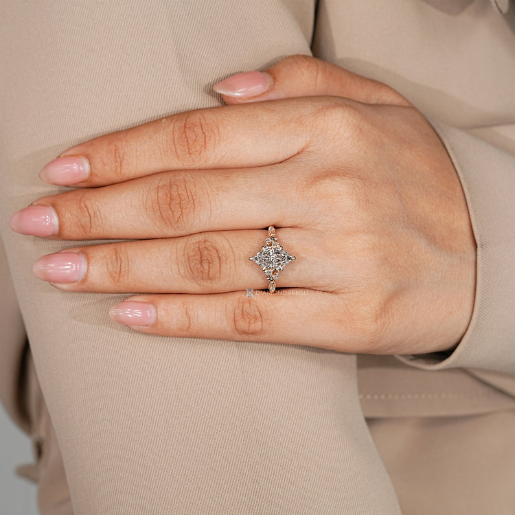 Dutch marquise diamond ring with round accent stones.