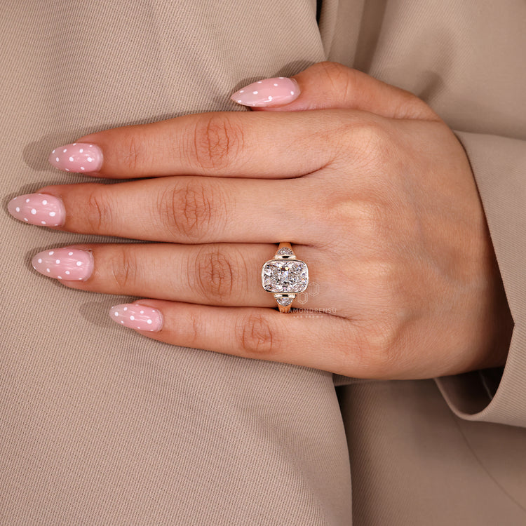 Cushion cut diamond ring with bezel setting style.