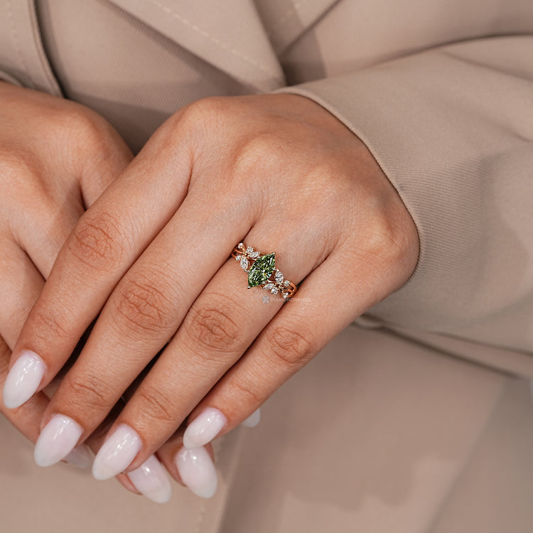 Marquise ring with marquise and round side stones.