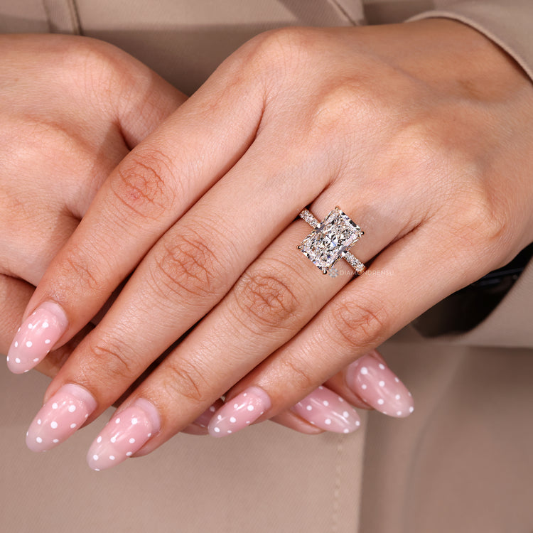 Radiant cut ring with four claw prong setting.