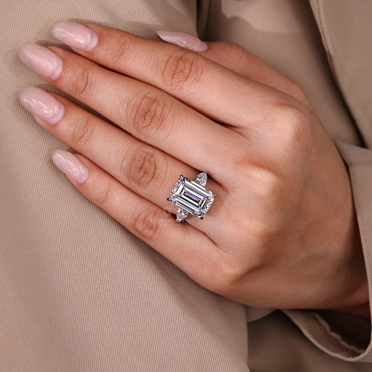 Emerald ring with four claw prong secure setting.