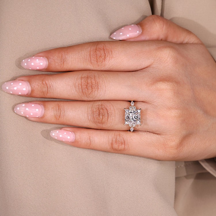 Seven stone diamond ring with tapered shank design.