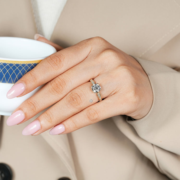 Handmade round diamond ring with pinch shank design.