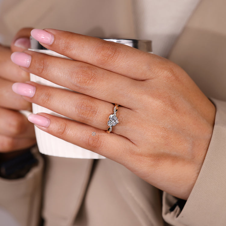 Handmade pave engagement ring with heart cut diamond.