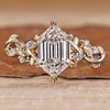 Hexagon cut diamond ring with round side stones.