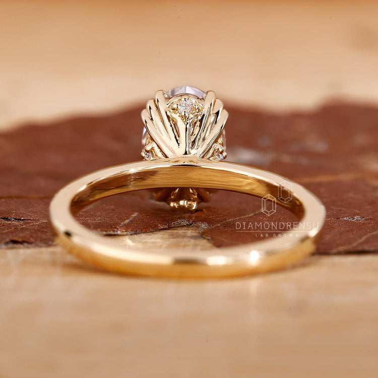 Diamondrensu oval diamond ring with hidden accent stones.