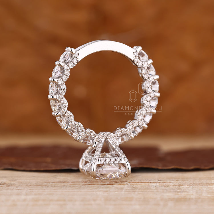 Radiant lab diamond ring with hidden halo and accents.