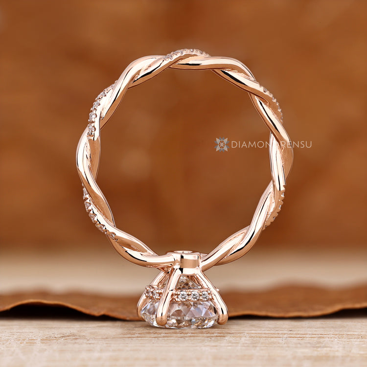 Four prong Portuguese cut diamond engagement ring.