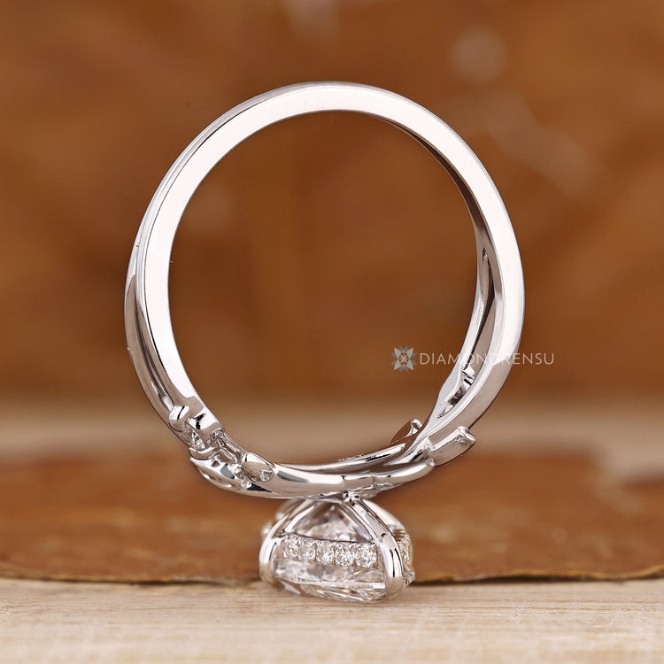 Marquise diamond ring with twisted shank and prongs.