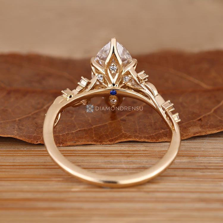Nature inspired marquise ring with hidden gemstones.