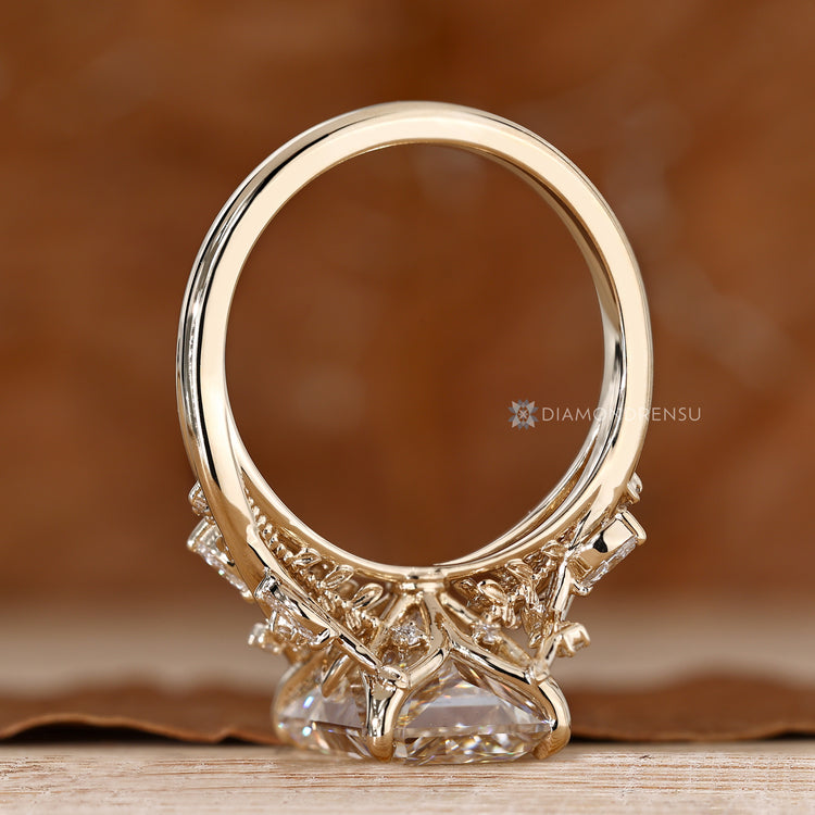 Radiant diamond ring with four claw prong setting.