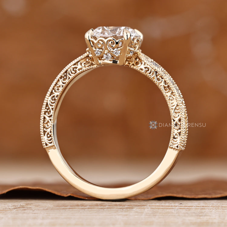 Round cut engagement ring with milgrain detailing.
