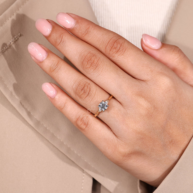 Handmade round diamond ring with side stones and outline.