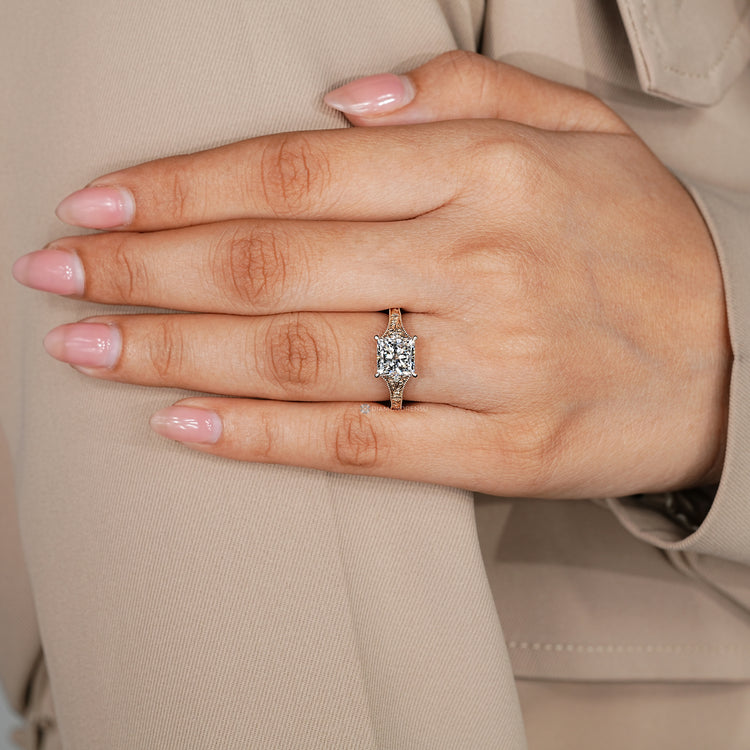 Art Deco engagement ring with princess cut centre diamond.