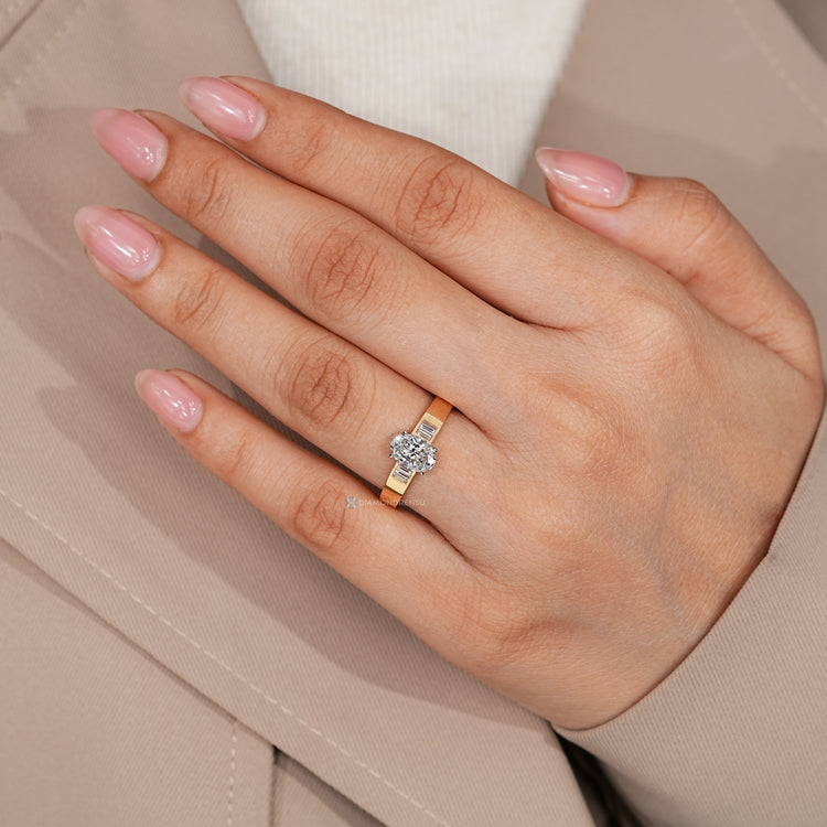 Two tone oval diamond ring with five stone design.