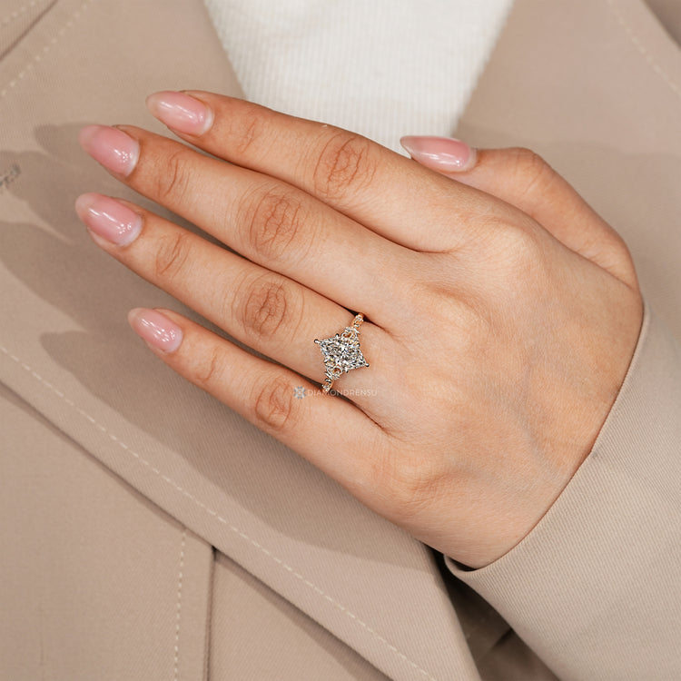 Dutch marquise diamond ring with branching leafy filigree.