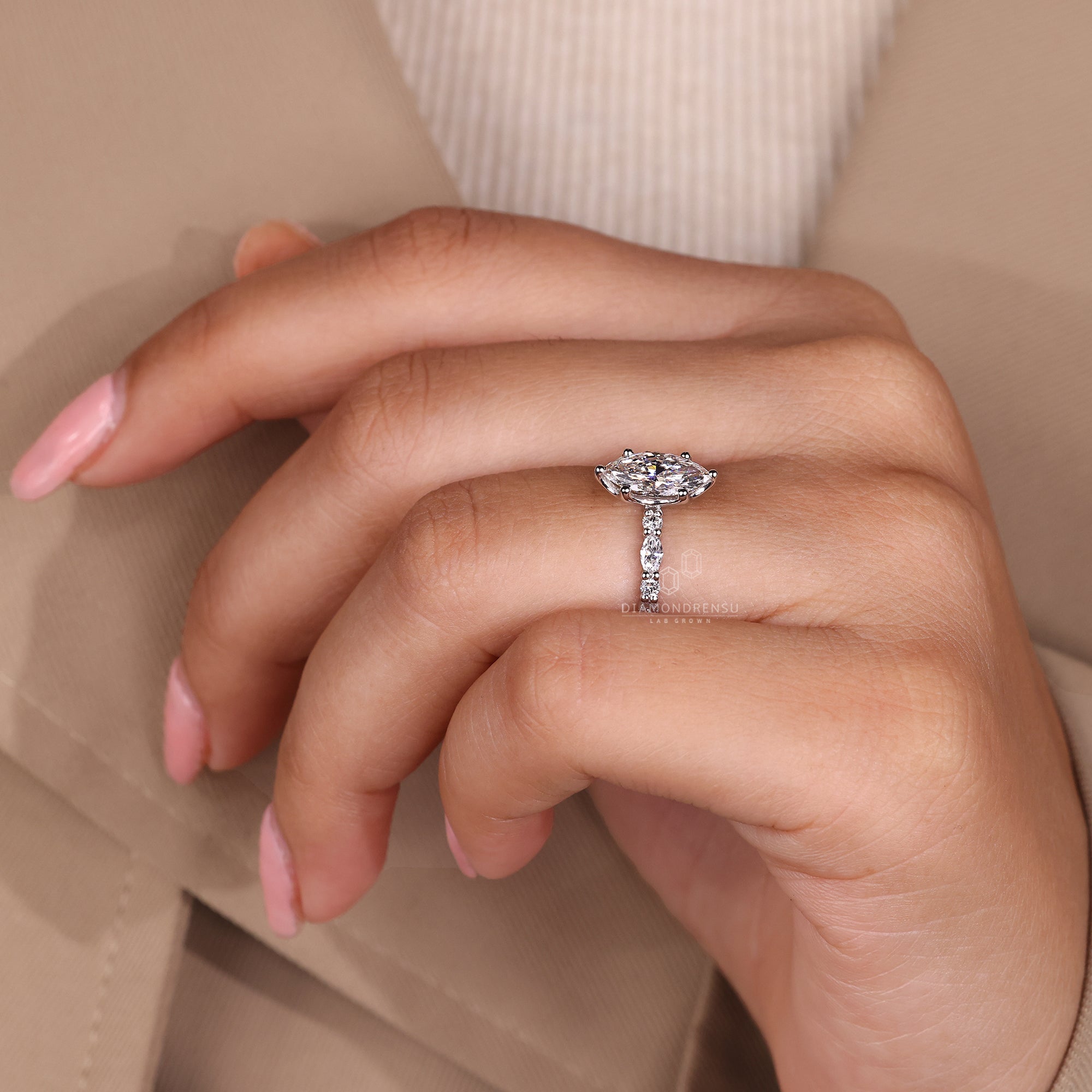 Designer engagement ring with marquise and pave mix.
