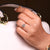 Round side stone ring with refined detailing.
