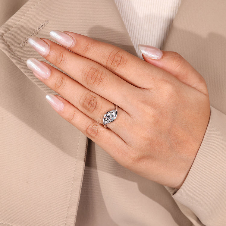 Handmade ring with bypass and prong detail.
