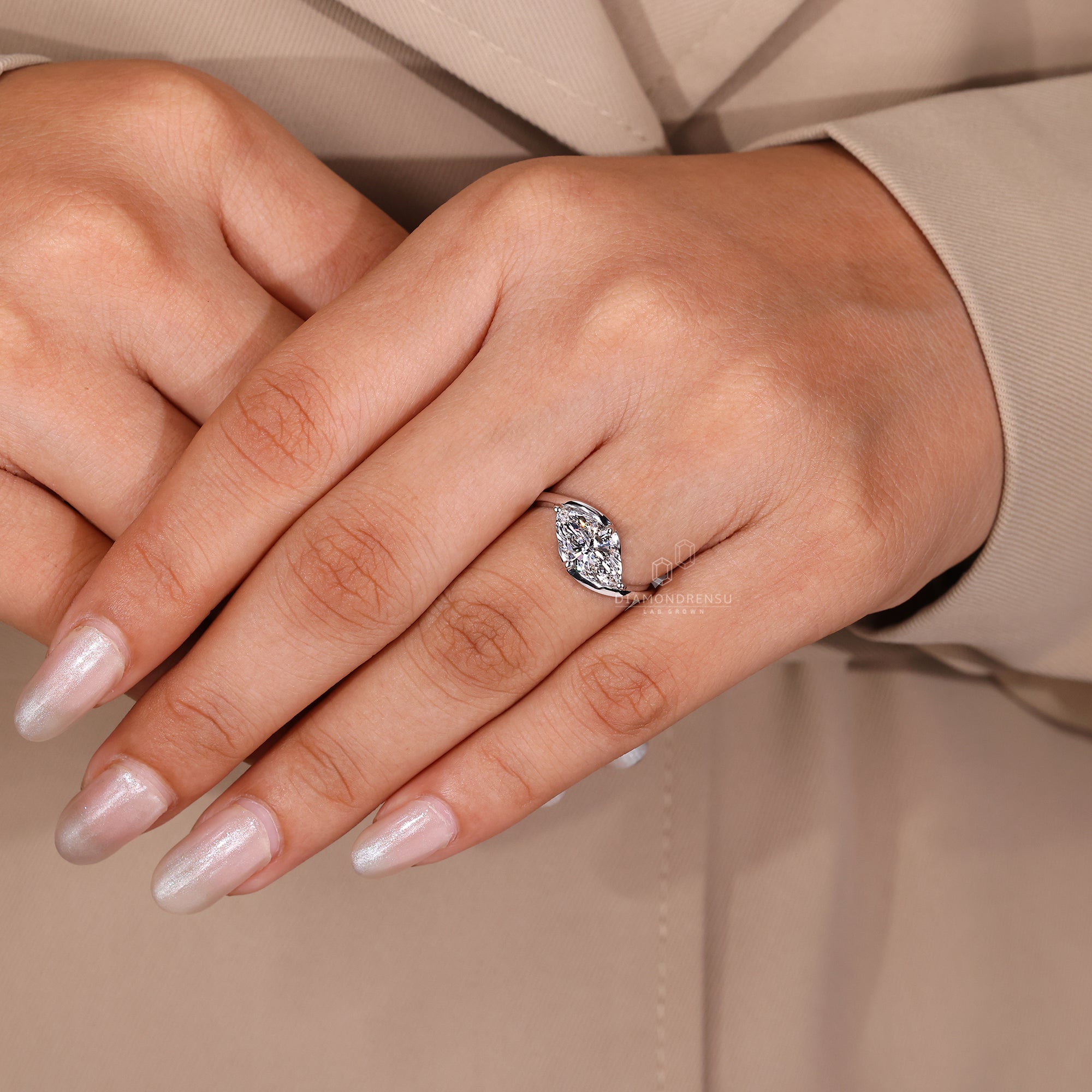 Diamondrensu UK ring with marquise center stone.
