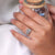 Radiant cut diamond ring with bright sparkle.
