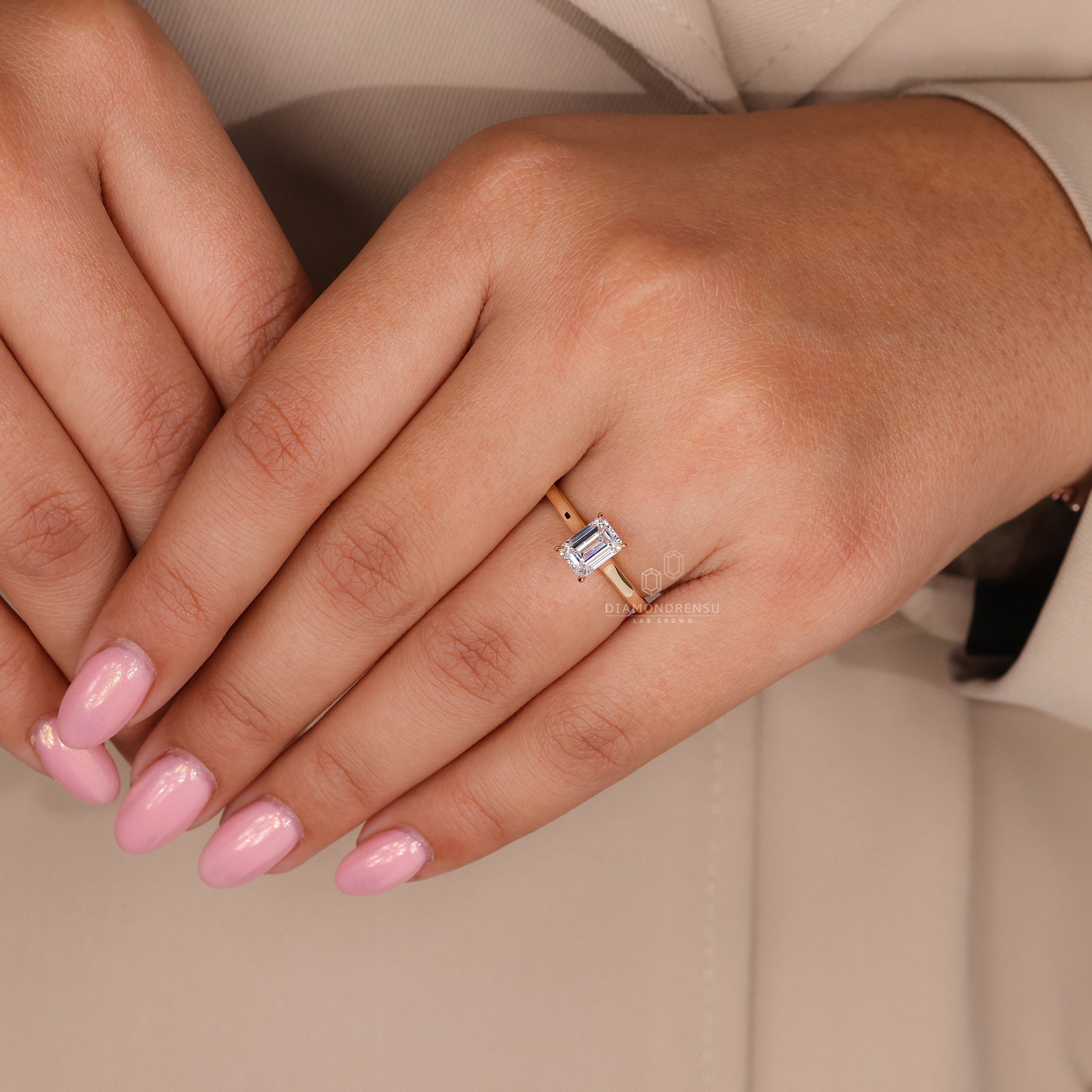 IGI certified emerald cut diamond ring in yellow gold.
