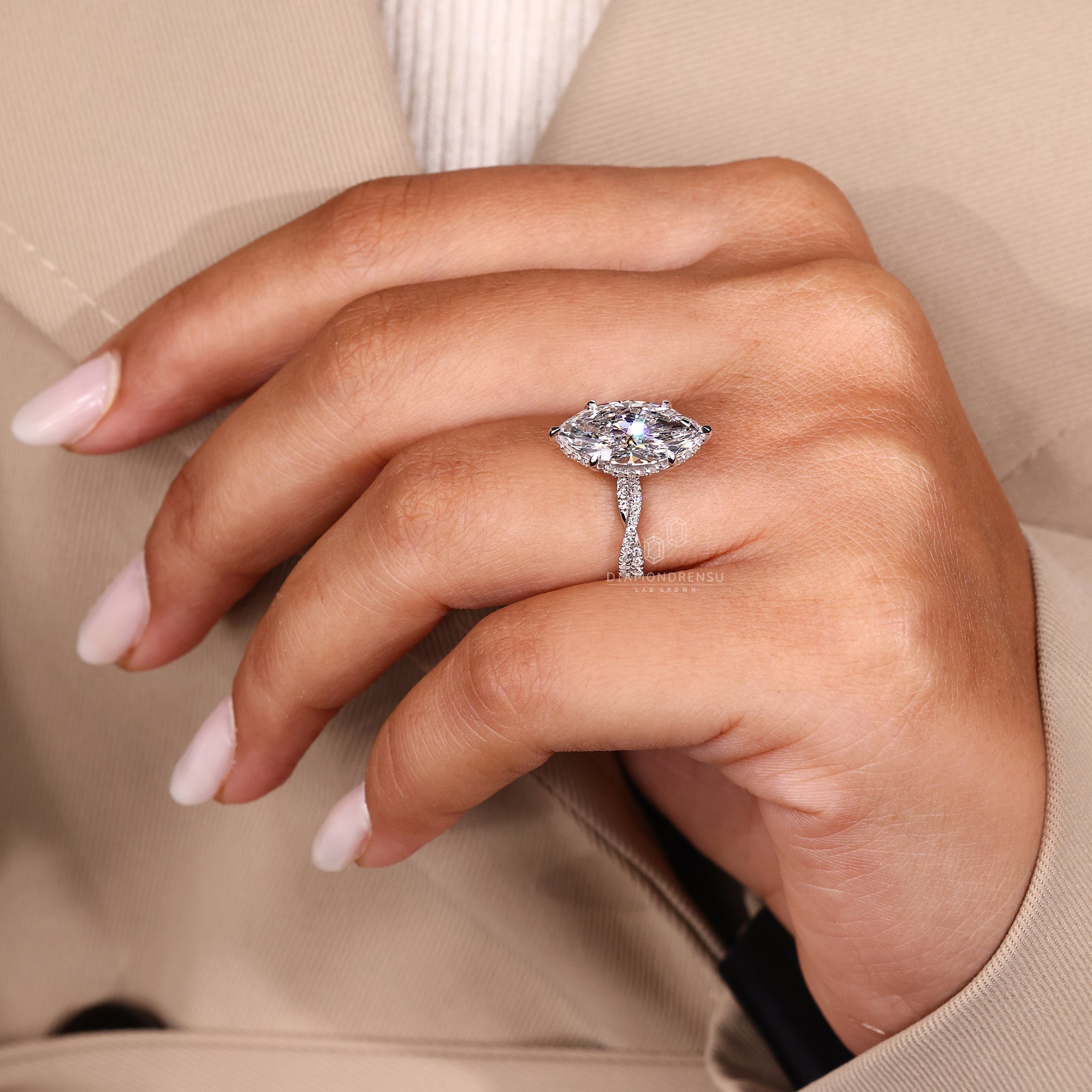 Custom engagement ring with marquise and round mix.
