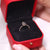 Yellow gold diamond ring with shared prong setting.
