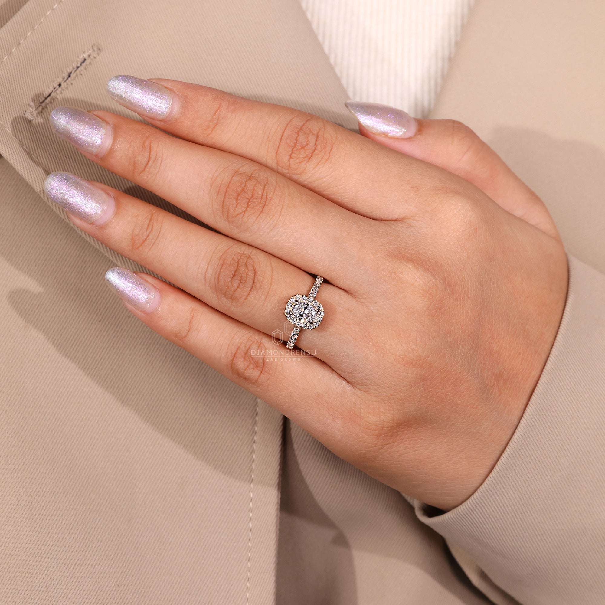 Custom engagement ring featuring oval and round mix.
