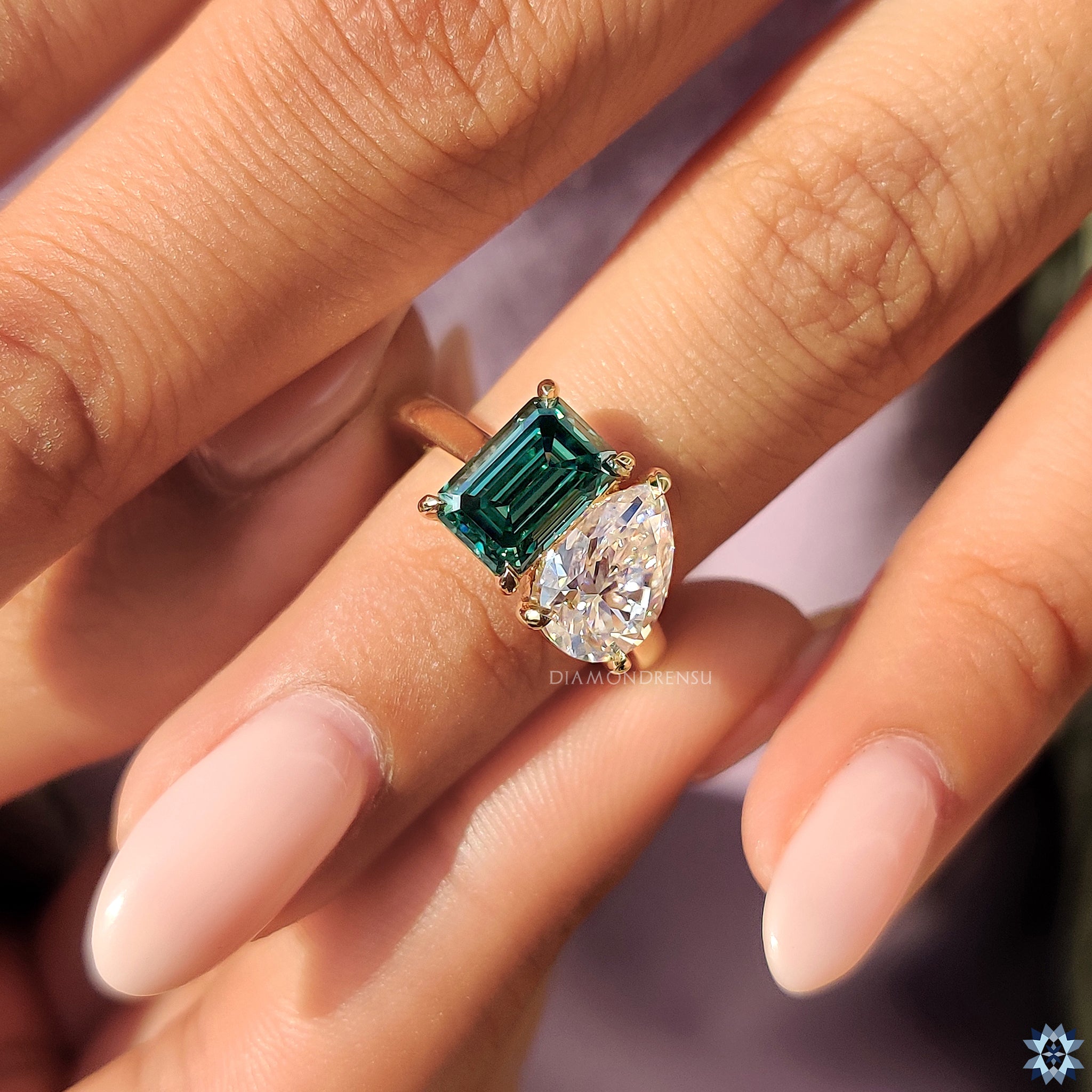Emerald engagement ring in moissanite ring design
