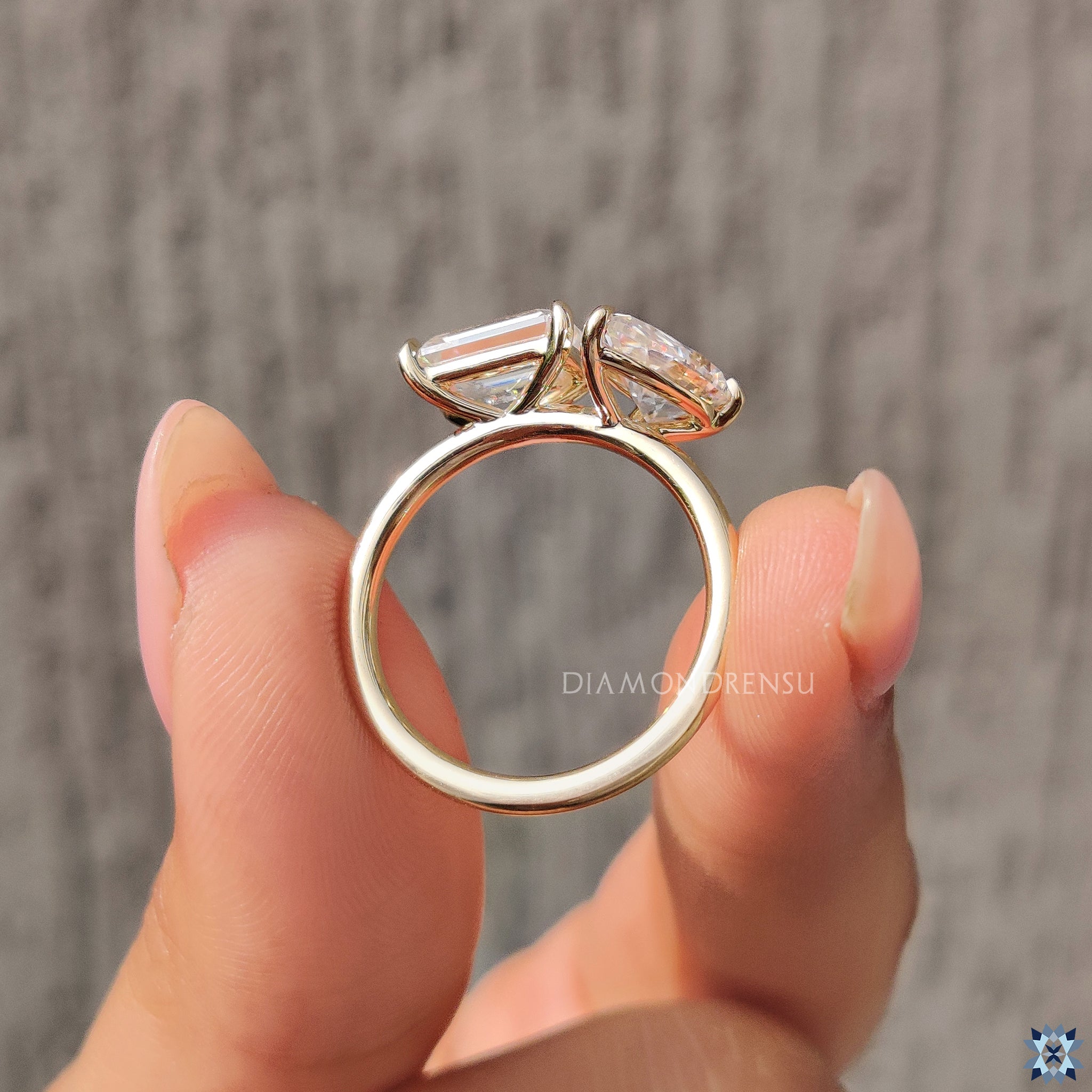 Yellow gold engagement ring with custom pear and emerald moissanite design.
