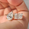 Toi et moi engagement ring with pear and emerald moissanite stones.
