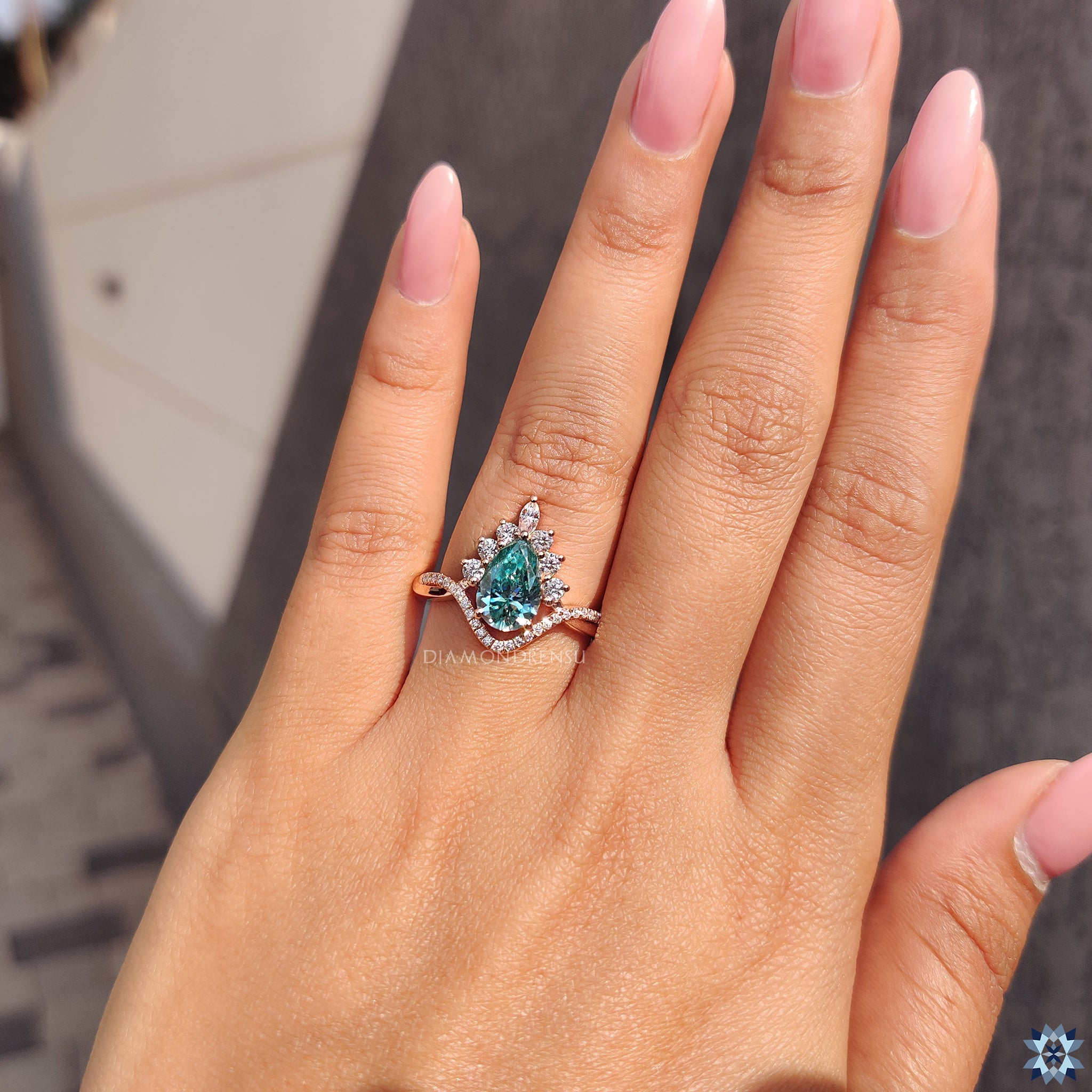 Cyan blue Moissanite ring with marquise and round cut halo.
