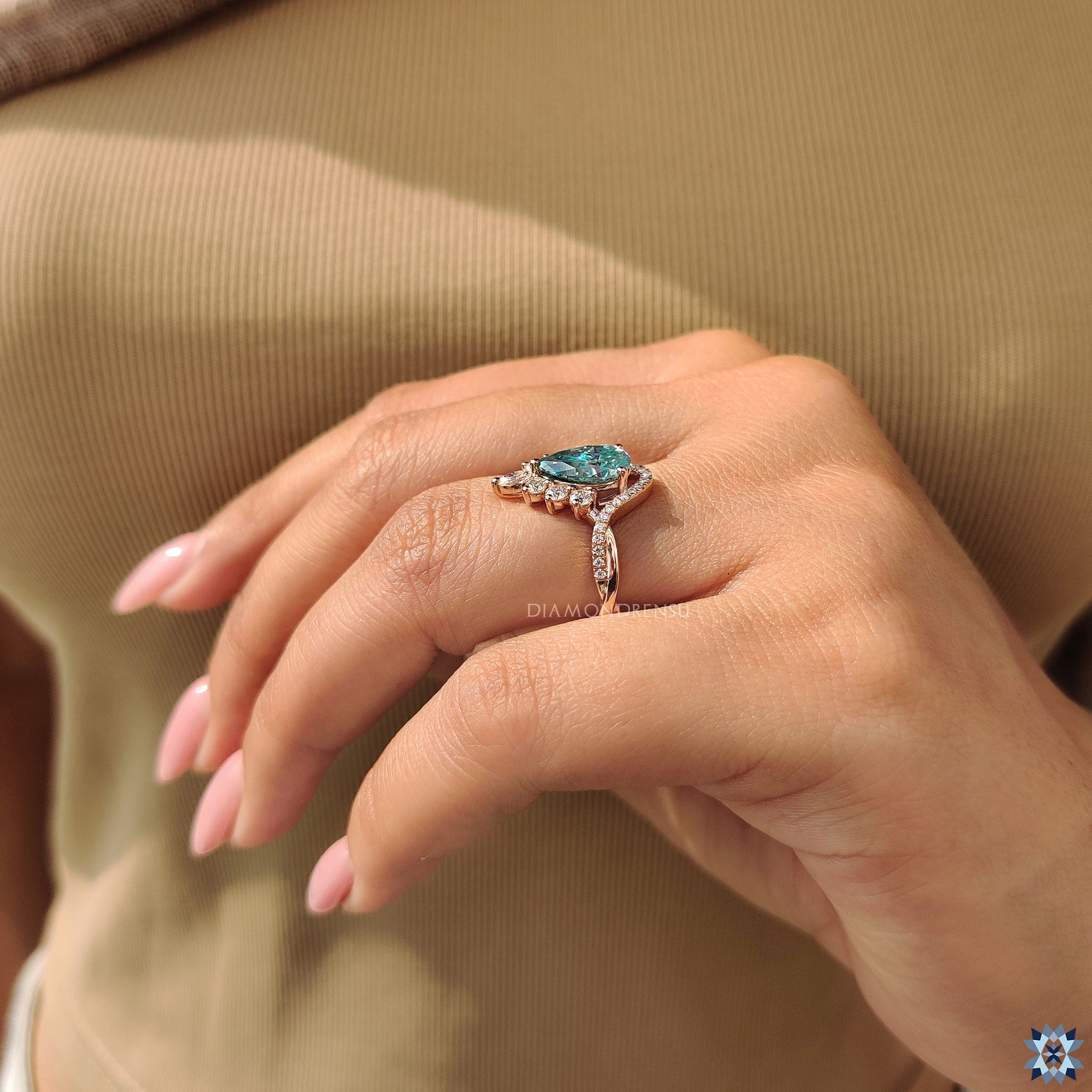 Handmade engagement ring with cyan blue pear Moissanite.
