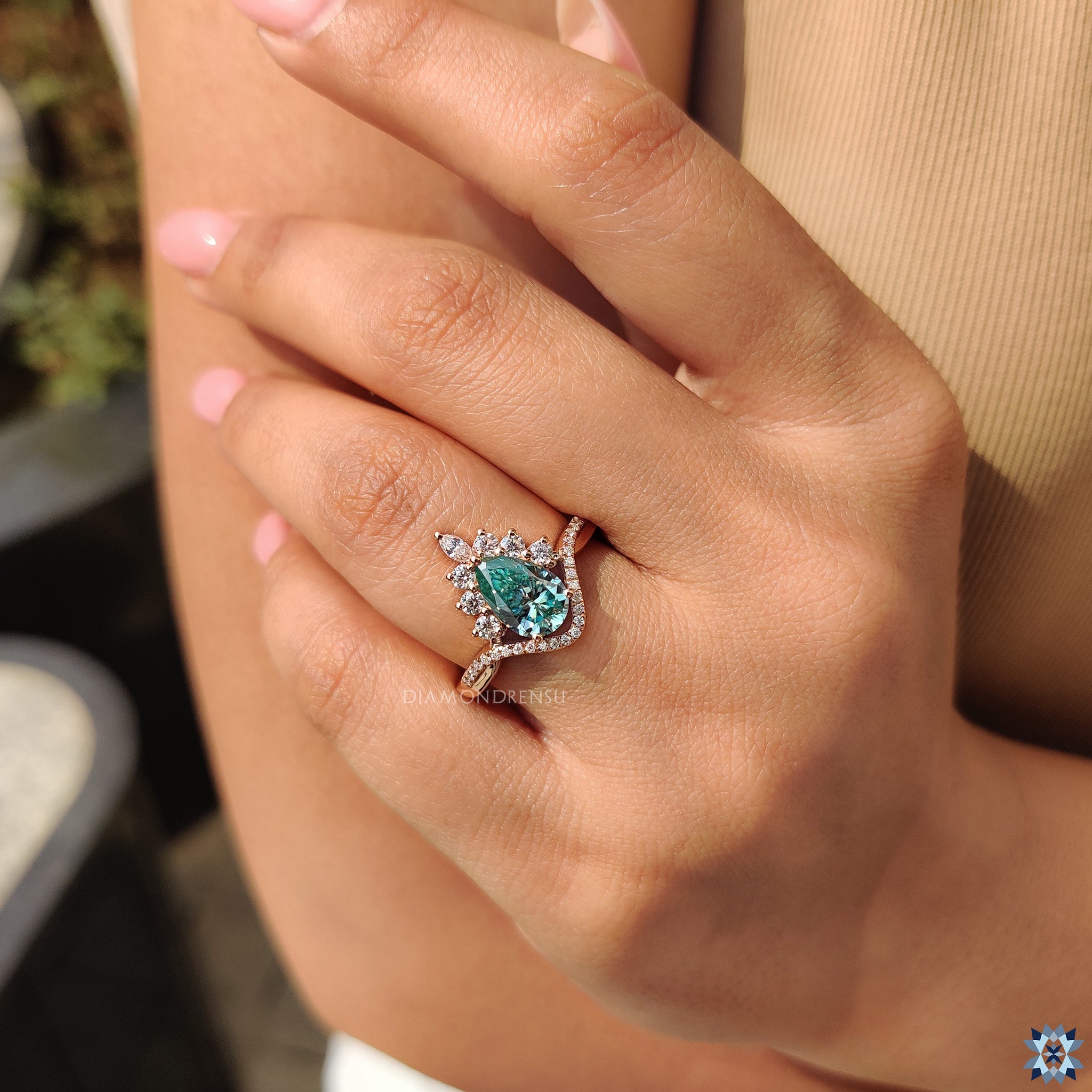 Handmade jewellery with cyan blue pear cut Moissanite stone.

