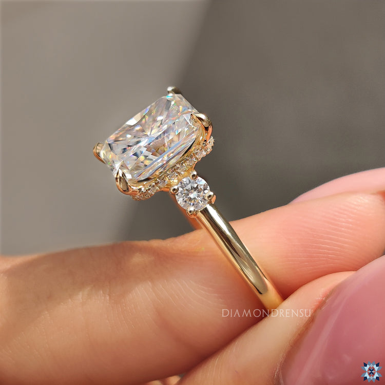 Hidden halo ring designed with radiant cut centre and euro shank band.
