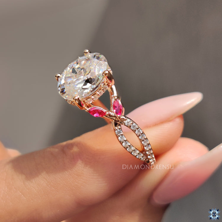 Custom engagement ring with oval centre and round cut pave band.
