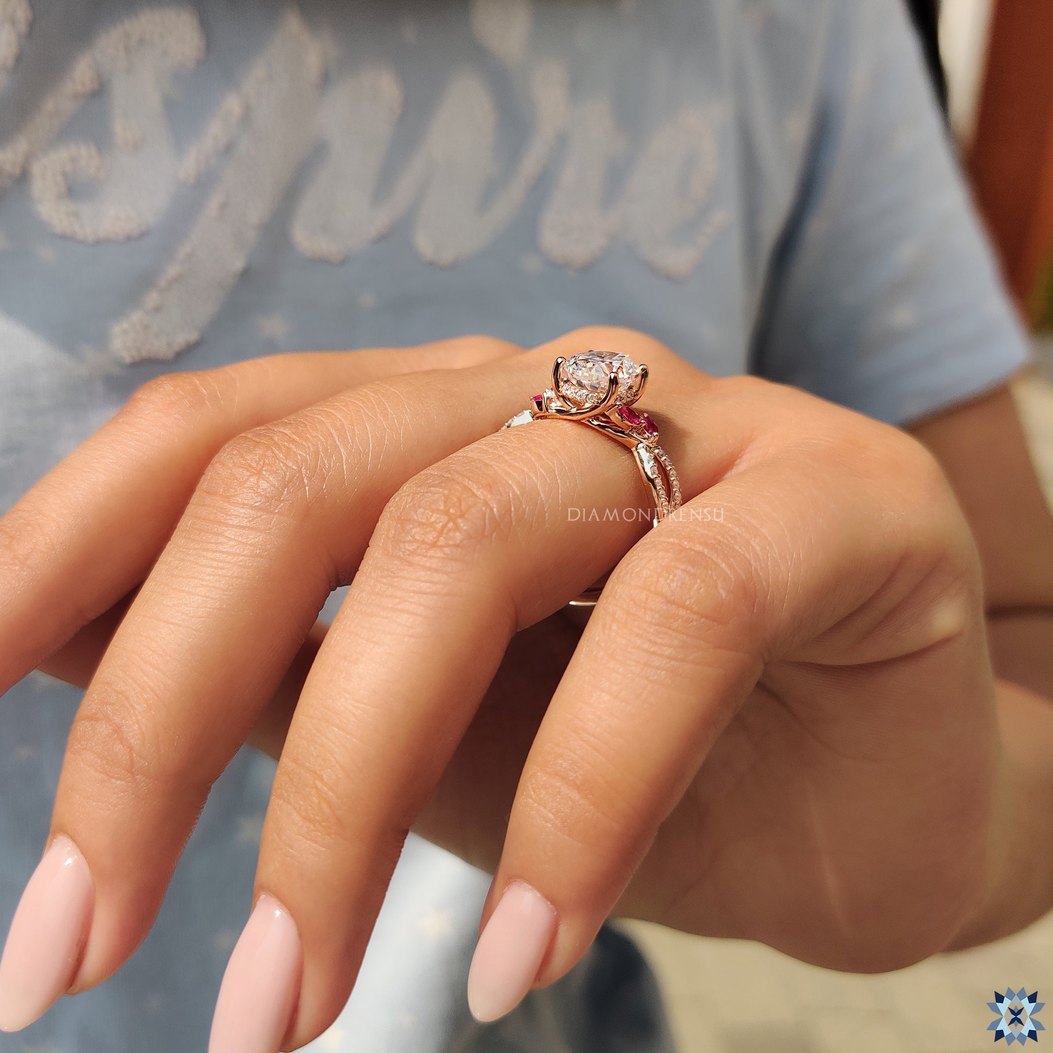 Diamondrensu UK engagement ring designed with red marquise stones and oval moissanite.
