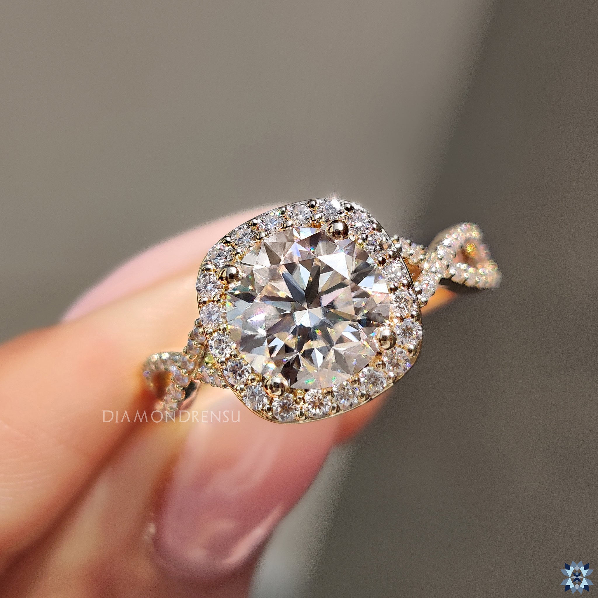 Buy moissanite ring with halo setting and round cut centre stone.
