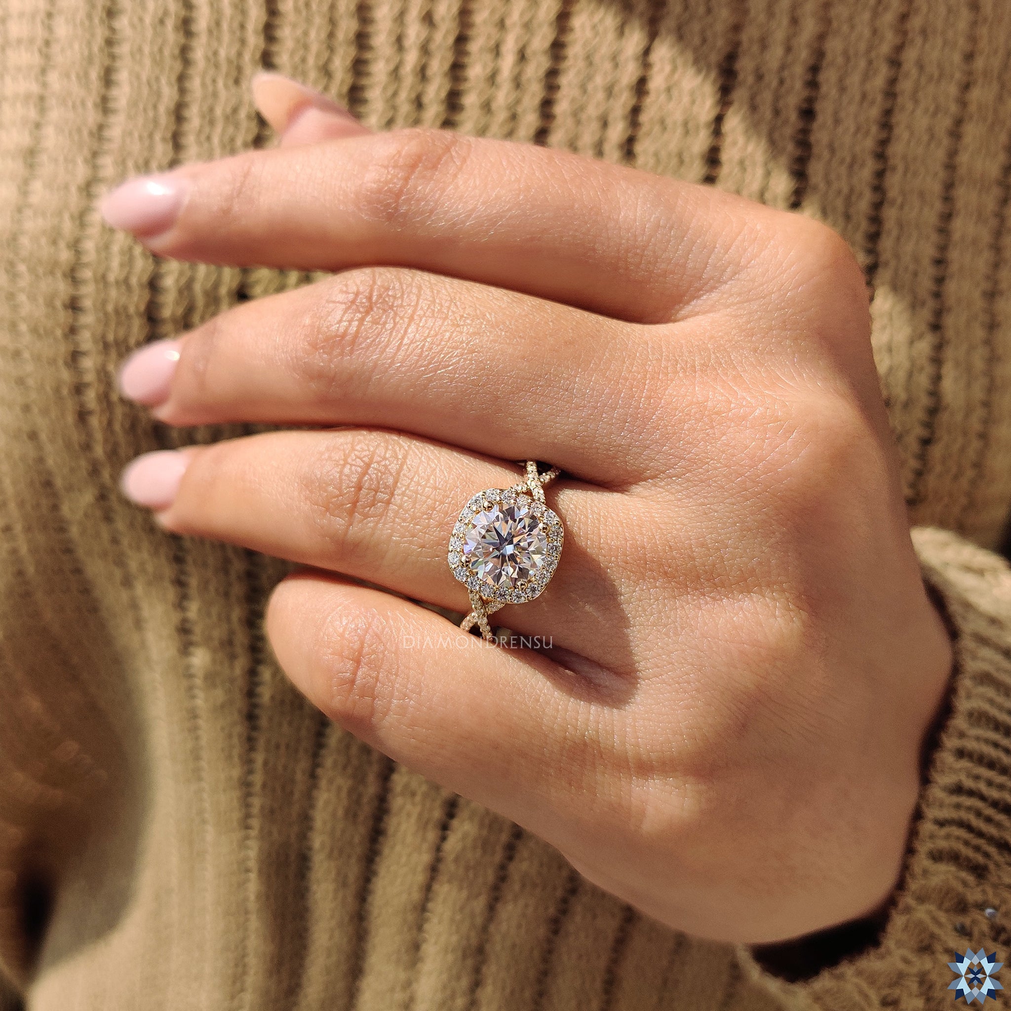 Custom engagement ring with round cut moissanite and twisted pave band.
