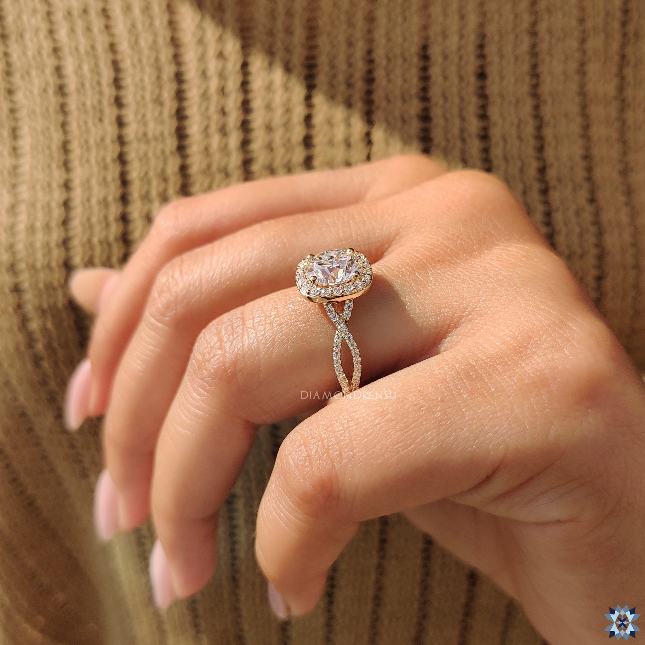 Moissanite engagement ring featuring yellow gold and round cut halo setting.
