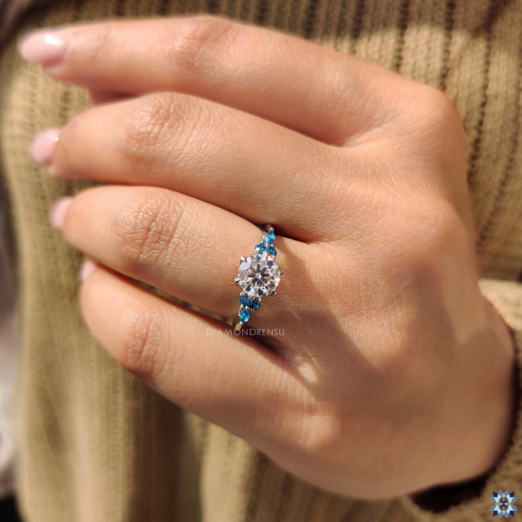Blue moissanite ring in moissanite ring setting
