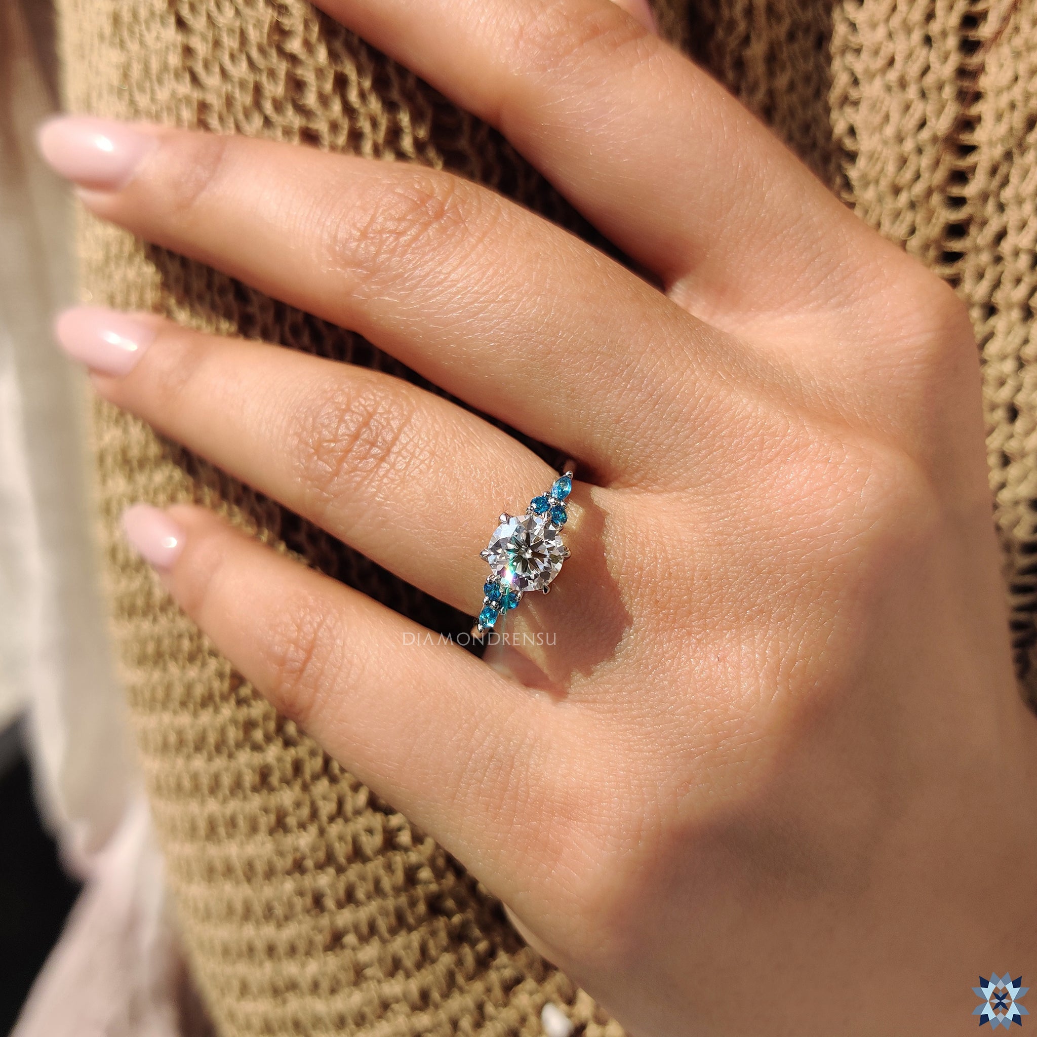 4 prong ring with blue moissanite ring
