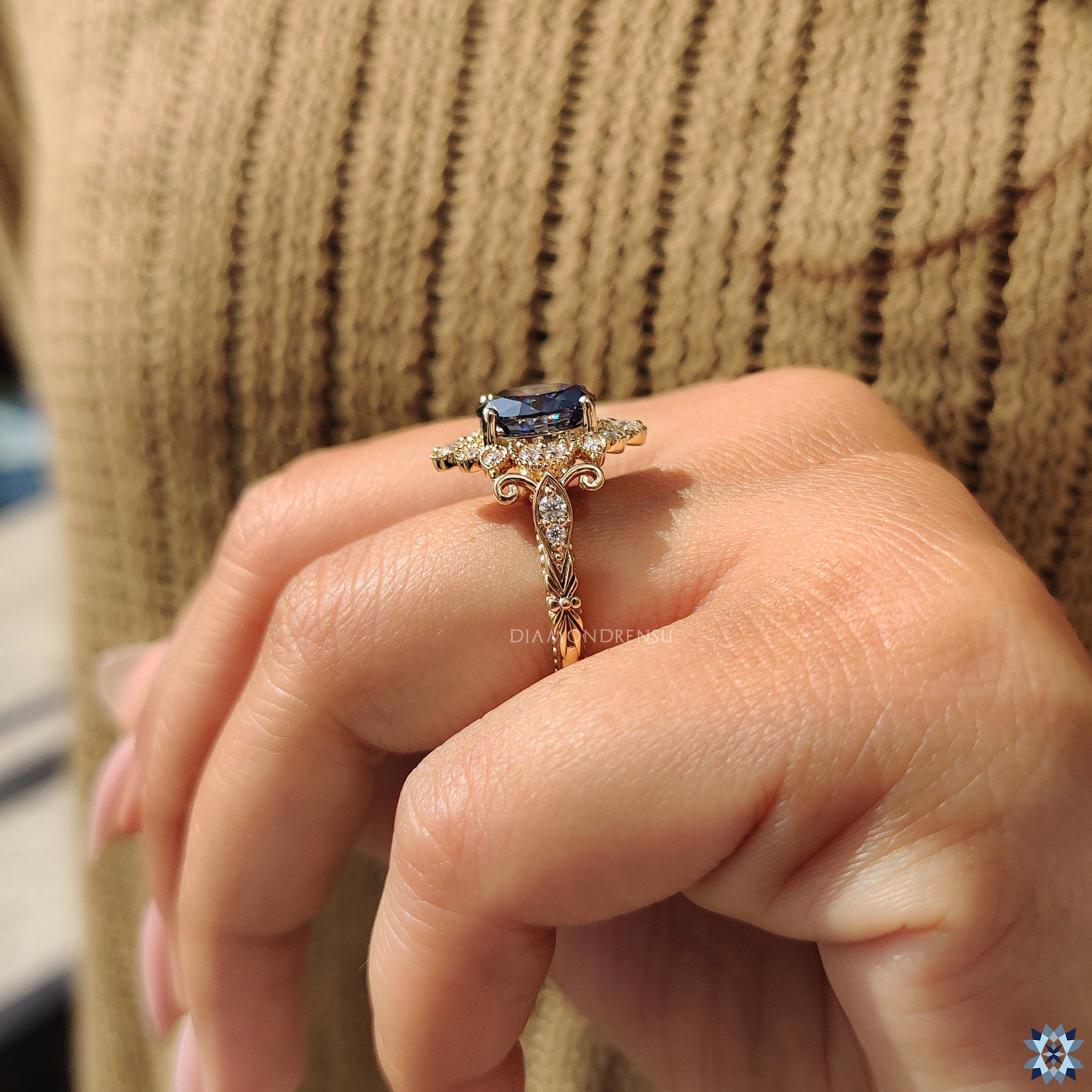 Art deco ring with oval moissanite and yellow gold band.
