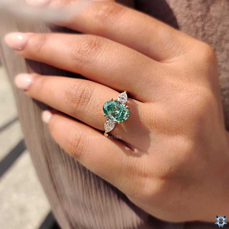 Pear shape ring in yellow gold ring setting
