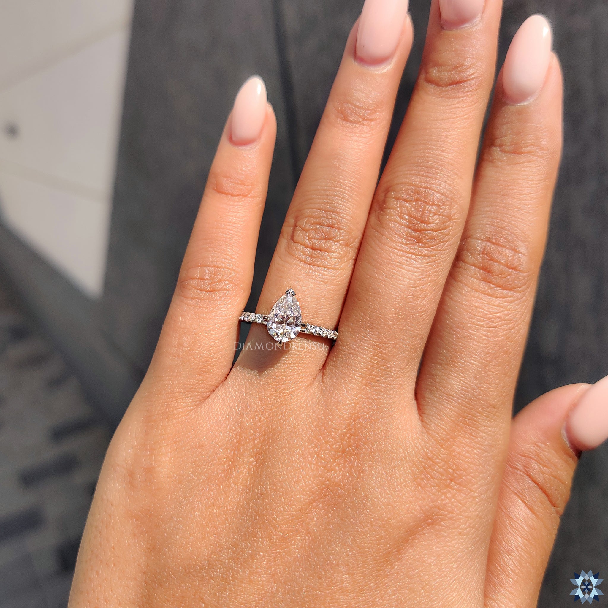 Round cut pave band featuring handmade moissanite and v shaped prongs.
