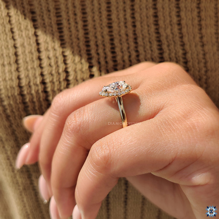 Buy moissanite ring with handmade pear cut and cathedral setting.
