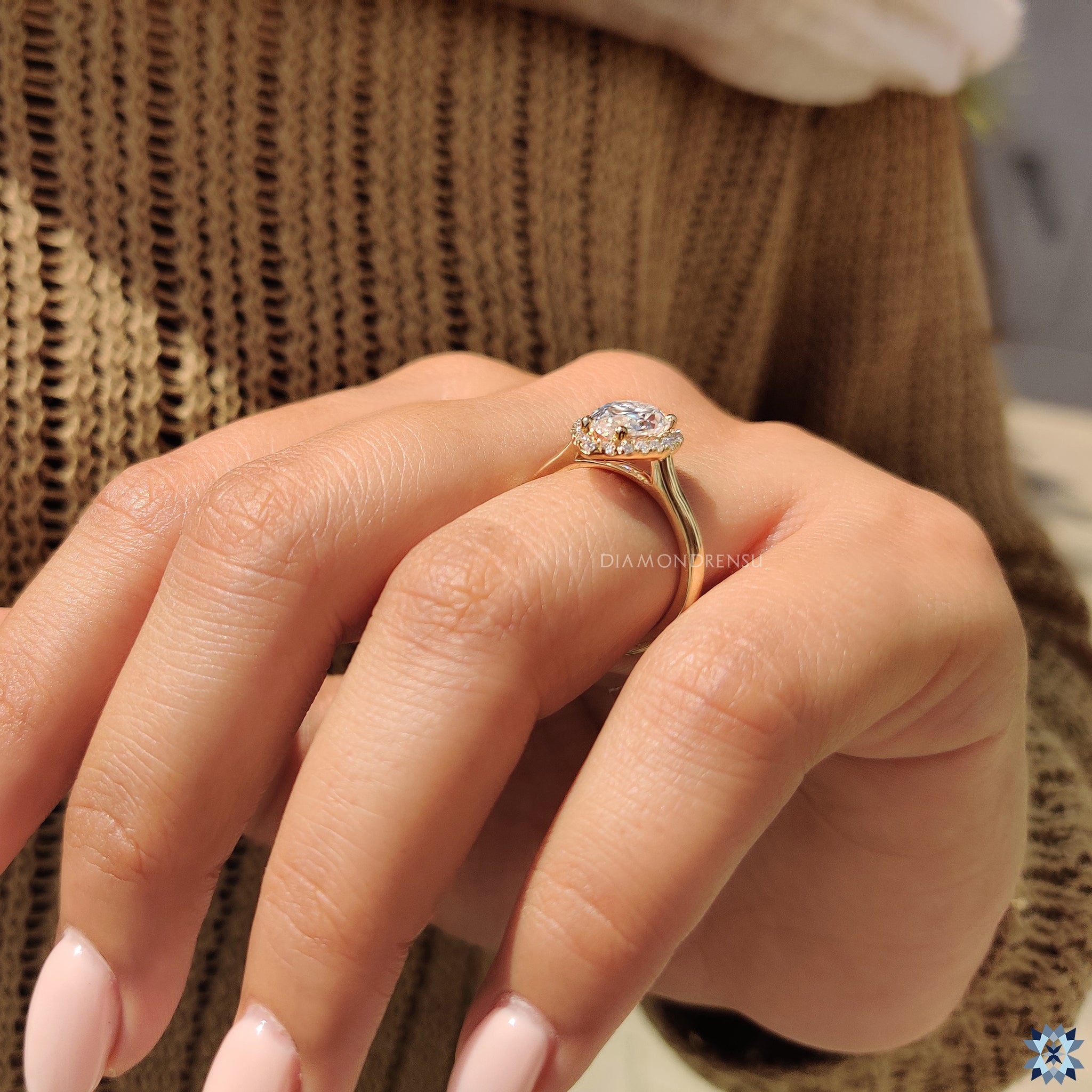 Moissanite ring UK design with halo and handmade pear moissanite.

