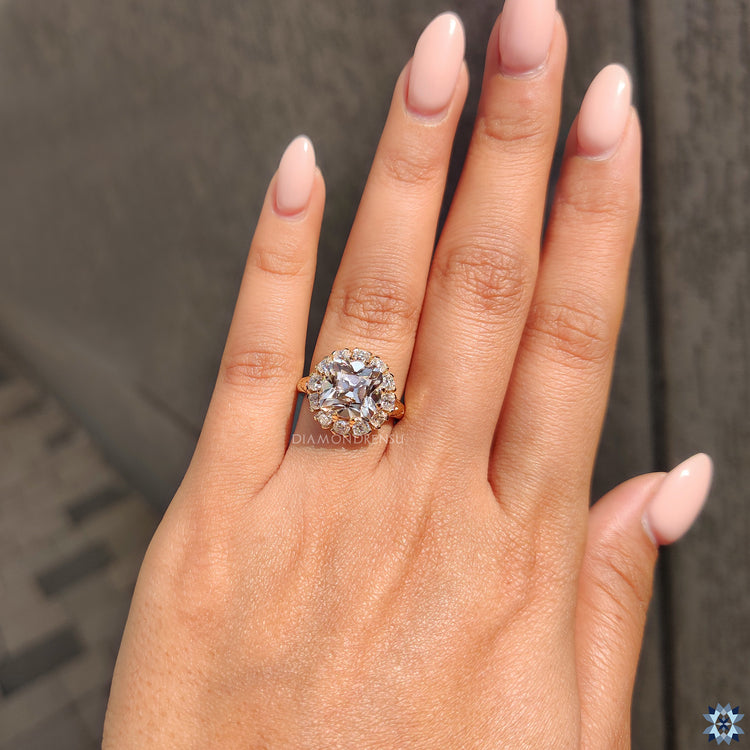 Under halo moissanite engagement ring in yellow gold.
