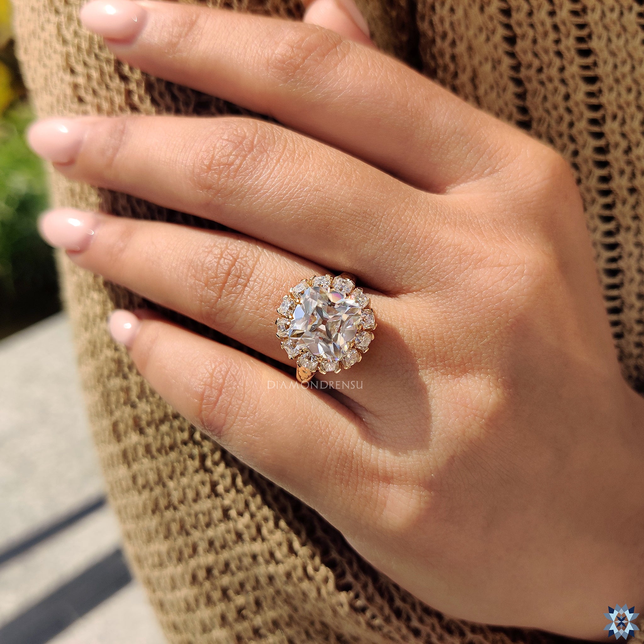 Custom moissanite engagement ring with cushion old mine cut center.
